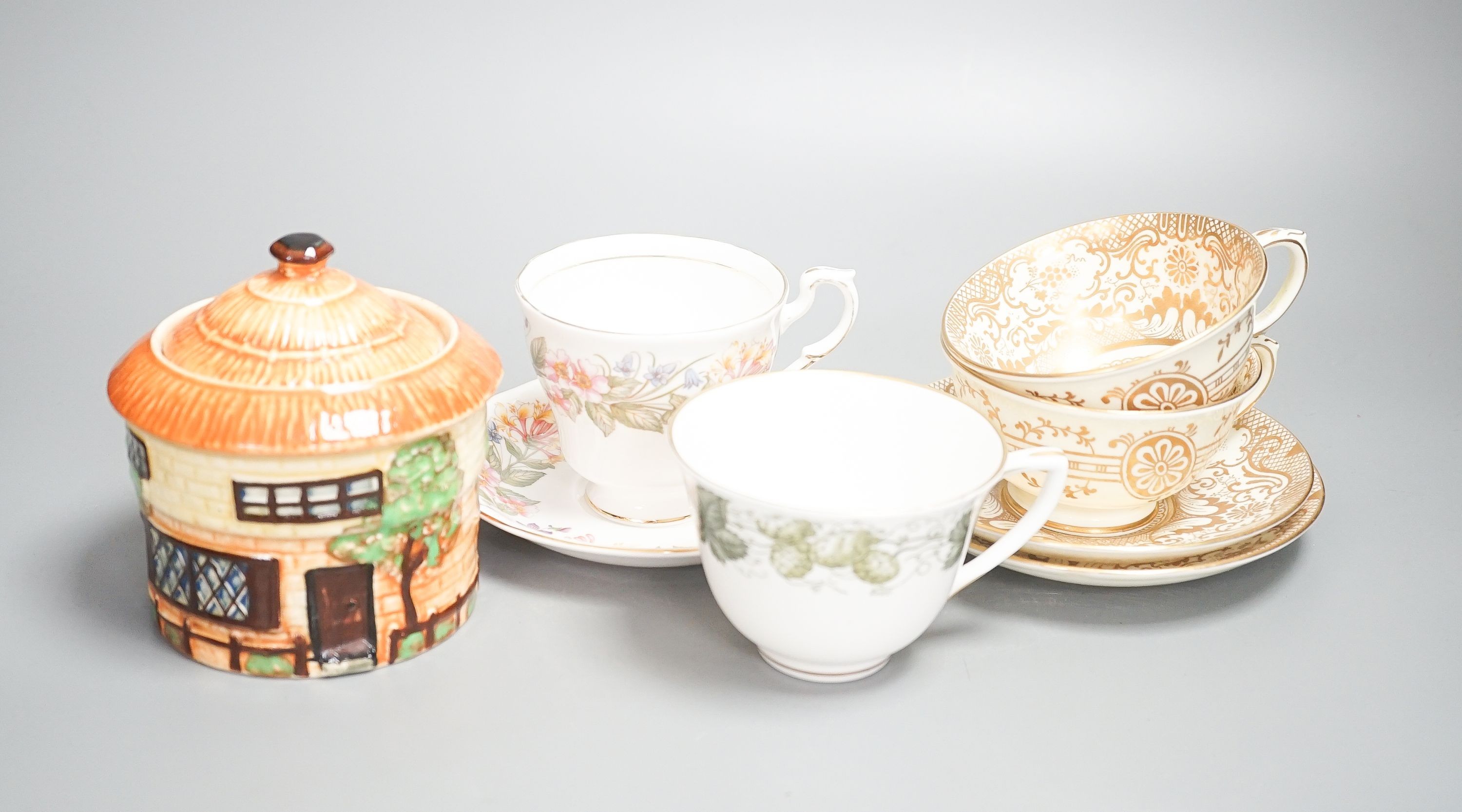 A Crown Staffordshire fifty nine piece part tea set and dessert service, central flowers and gilt borders, a Paragon part tea set and other ceramics